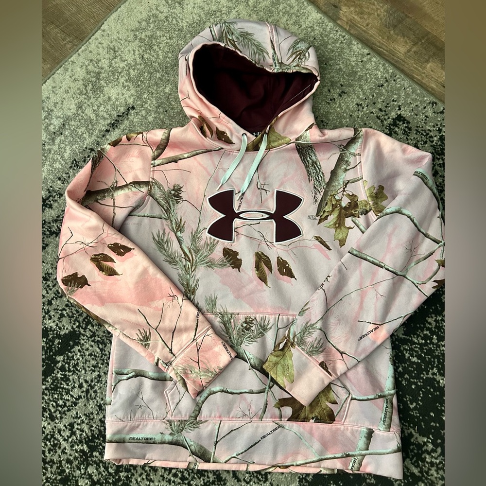 Under Armour Women's Pullover Hoodie in a pink Realtree camouflage pattern.